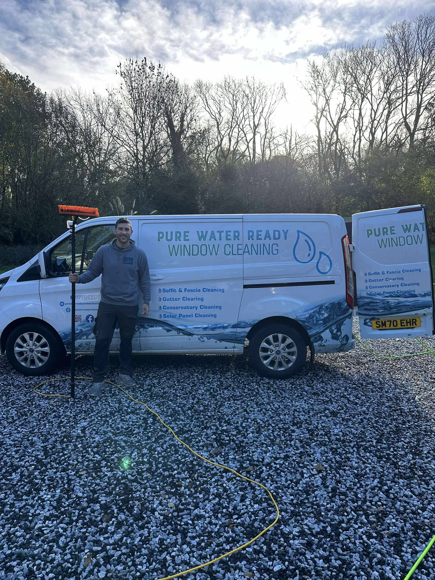 Chris standing beside the Pure Water Ready Window Cleaning van