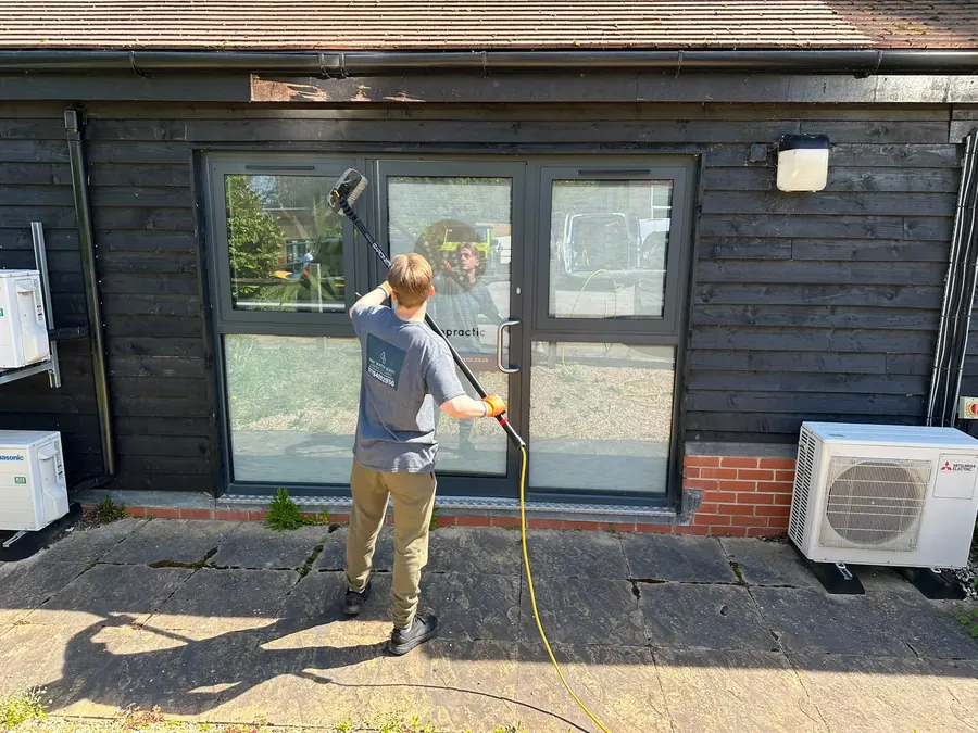Cleaning glass doors at a chiropractic office